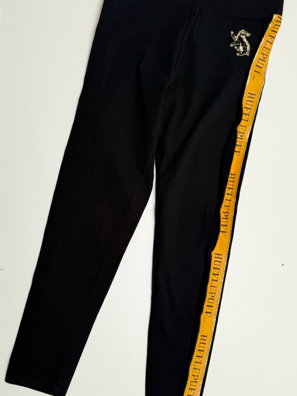Harry Potter themed Black Leggings with Yellow and Gold Hufflepuff Stripe, age 7